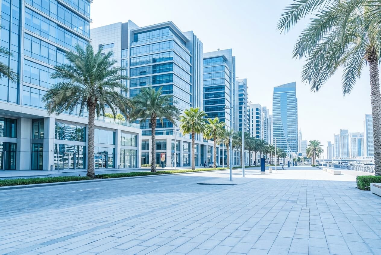 Modern commercial boulevard in Dubai with office buildings and storefronts